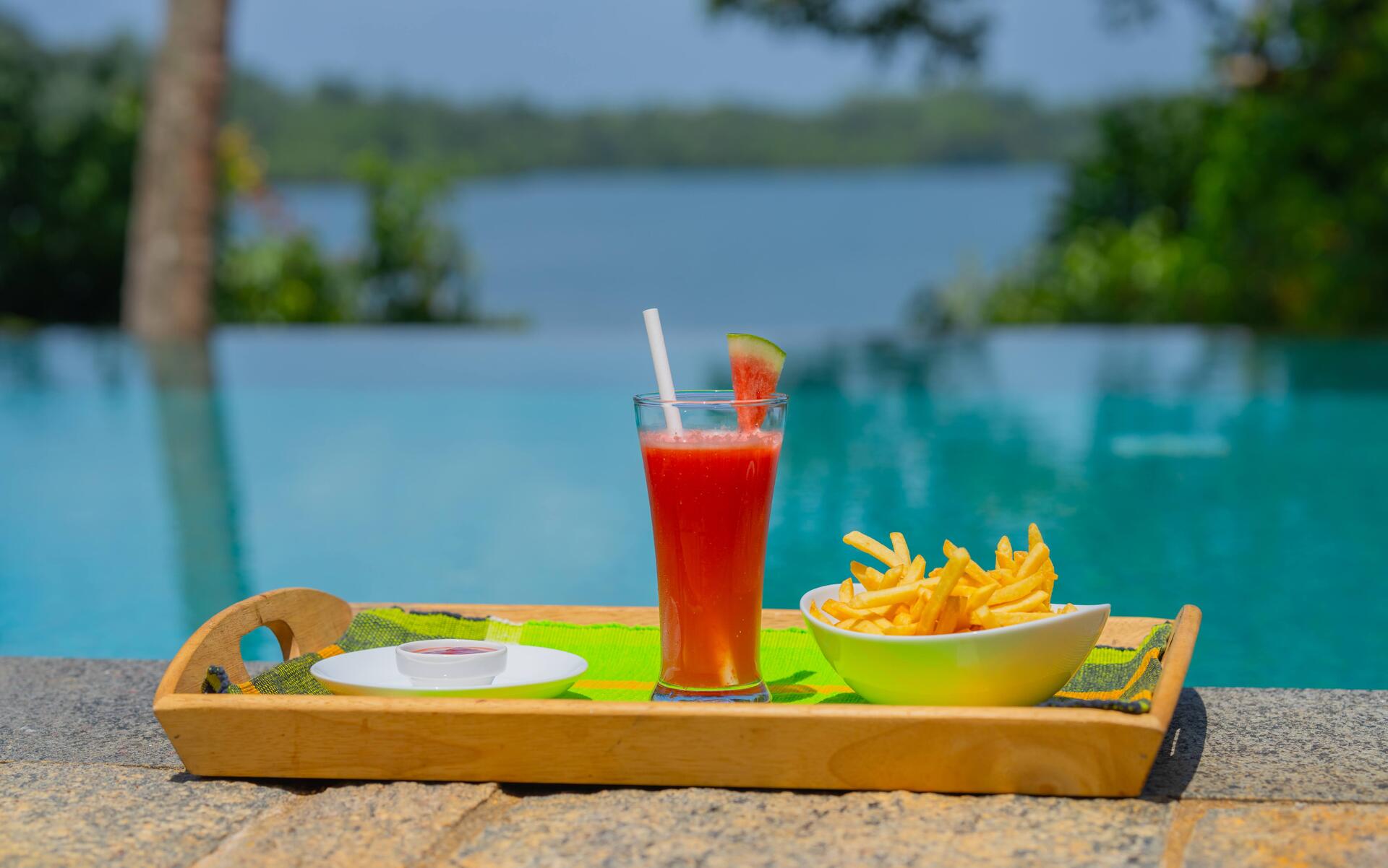 Tropical fruit platter and snacks by the infinity pool at Serendipity Lake