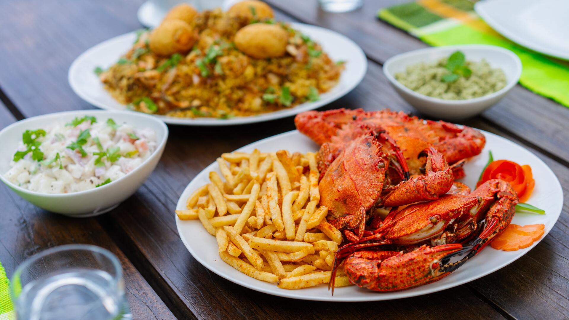 Lobster and seafood feast with fries prepared by Serendipity Lake private chef