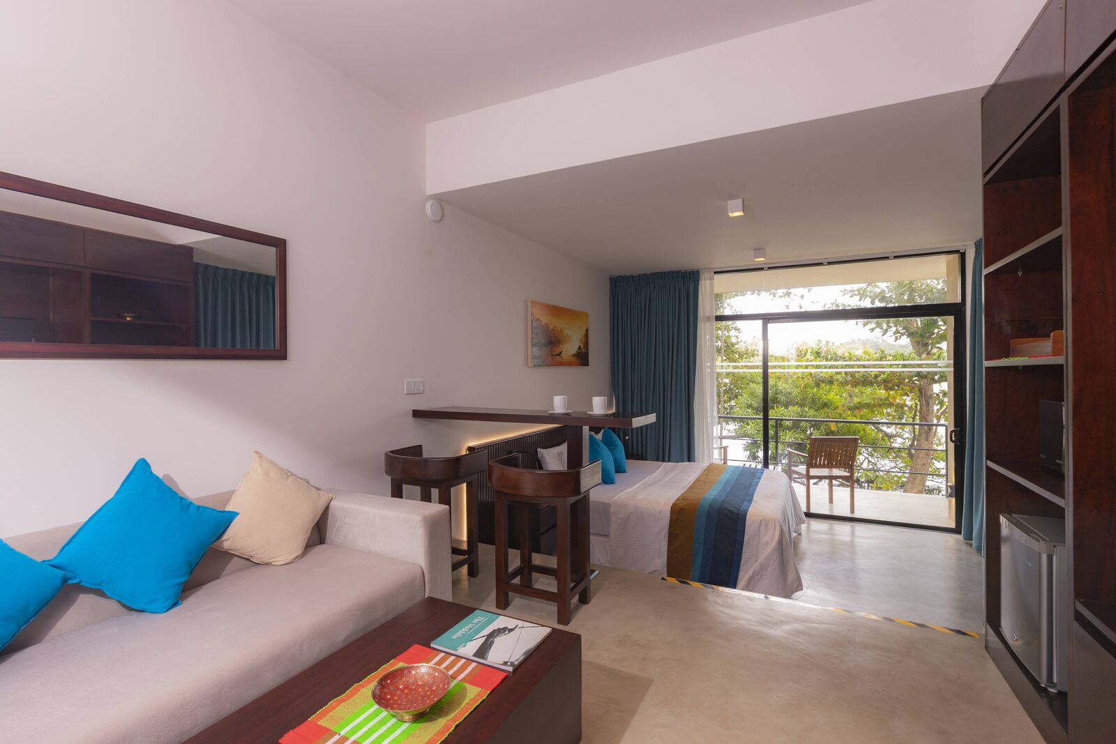 Lake View Orchard Suite main bedroom with king bed and garden access at Serendipity Lake Hikkaduwa